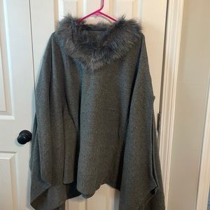 Gray wool like cape with faux fur neckline.